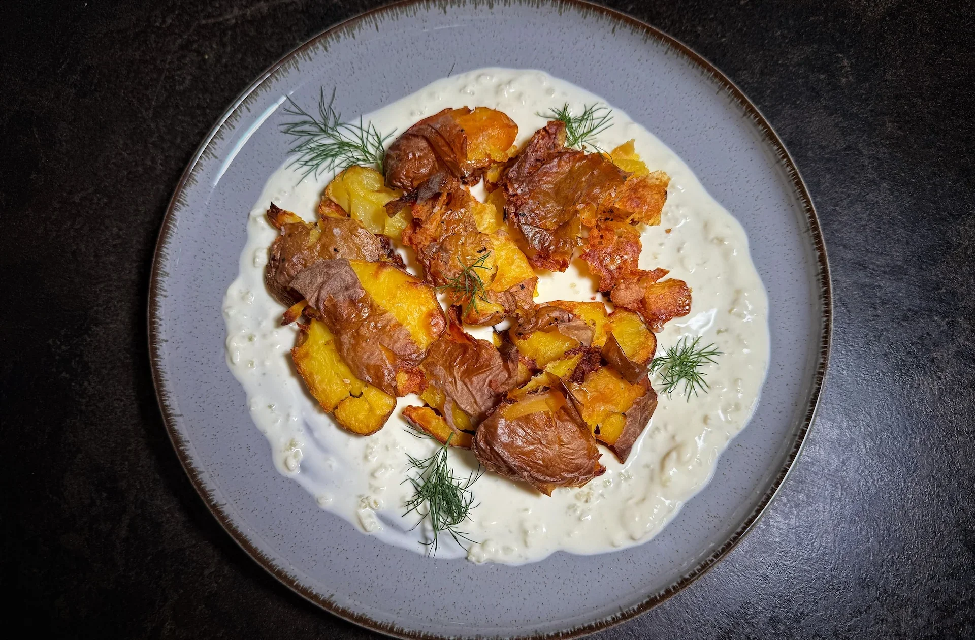 Crispy Smashed Potatoes on a Creamy Garlic Bed