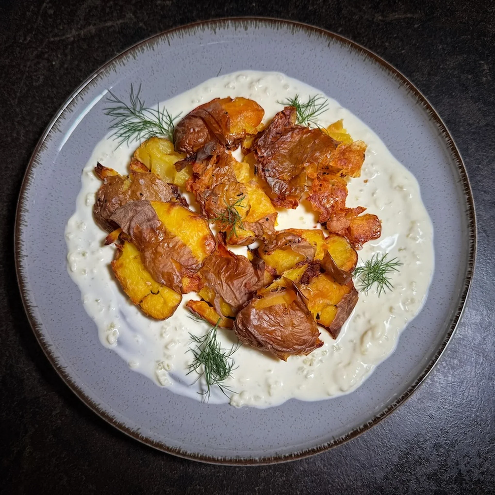 Crispy Smashed Potatoes on a Creamy Garlic Bed